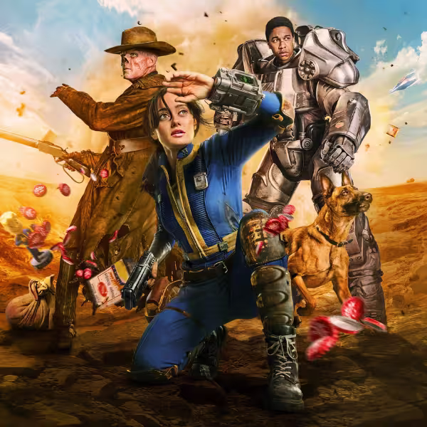 荒れた砂漠の風景の中、エラ・パーネルらメインキャストと犬が構えるように立っているアクション風のキービジュアル。