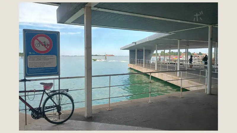 A bicycle at the Lido Island pier, overlooking the lagoon