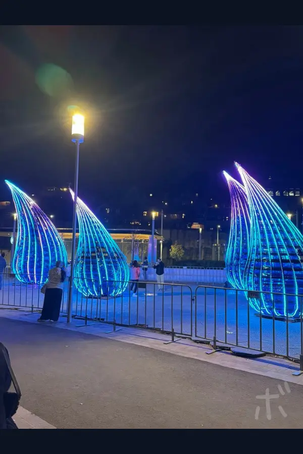 Blue light objects installed at the venue at night