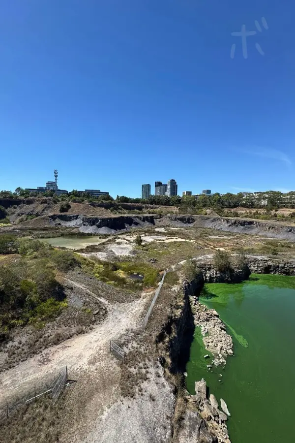 Green water surface spreading out in a place surrounded by cliffs