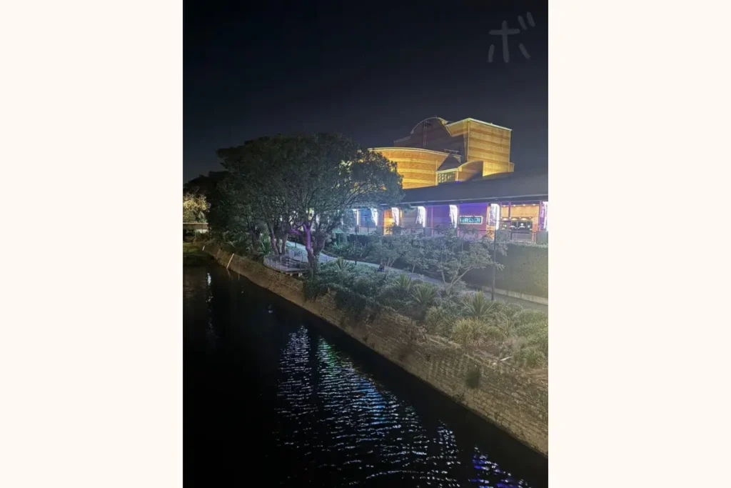 A view of a riverside theater and its reflection in the water at night in Parramatta, a suburb of Sydney, Australia.