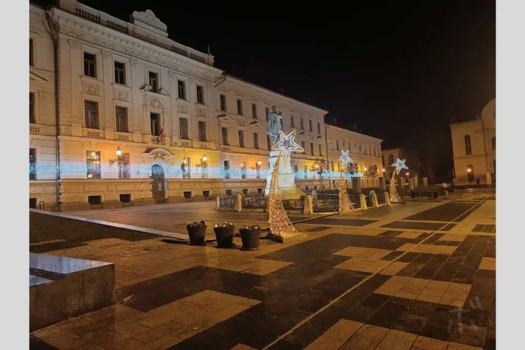 A quiet square in Hungary, illuminated on a winter night