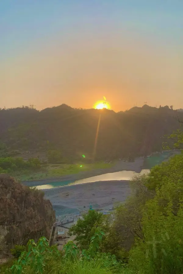 Sunset over the river and mountains of India and a peaceful sunset view