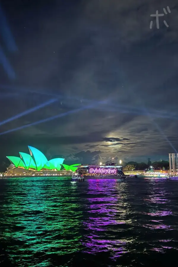 Opera House and water surface lit up in green