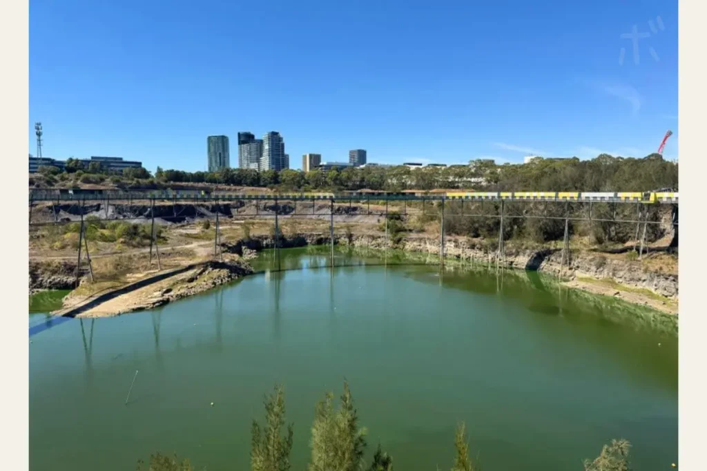View of city buildings beyond the quarry.