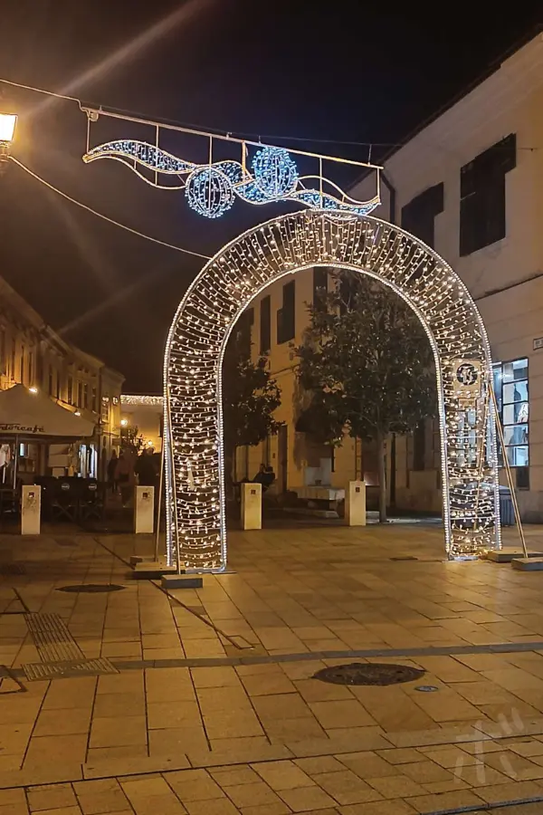 Illuminated arch on a winter night in a Hungarian city